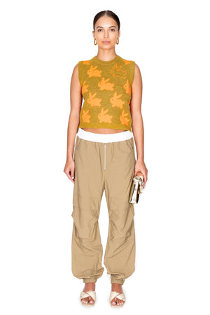 Model styled in the beige and white hybrid sweatpants.