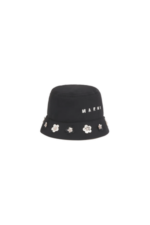 Black bucket hat with floral embellishments and 'Marni' branding on a beige background