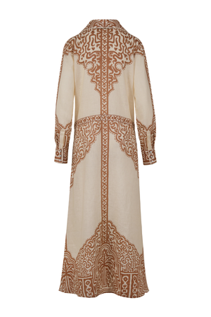 A long-sleeved maxi dress with intricate brown geometric and tribal patterns on a cream-colored base, shown from the back against a plain white background.