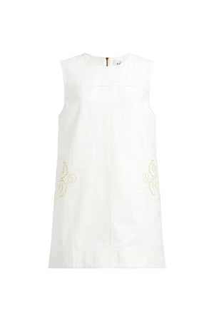 White sleeveless top with lace details on a light gray background