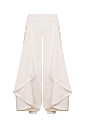 A pair of high-waisted, wide-leg trousers in a soft cream fabric, featuring draped side panels and gathered cuffs, shown against a plain white background.