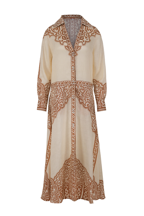A long-sleeved cream-colored maxi dress with intricate brown and beige paisley embroidery, featuring a V-neckline and buttons down the entire dress