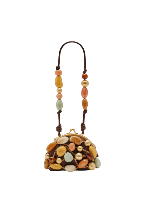 A small handbag with a dark brown leather base and handle, decorated with numerous smooth, polished stones in earthy tones of orange, yellow, beige, and light blue. The bag has a gold-tone metal clasp and is shown against a plain white background.