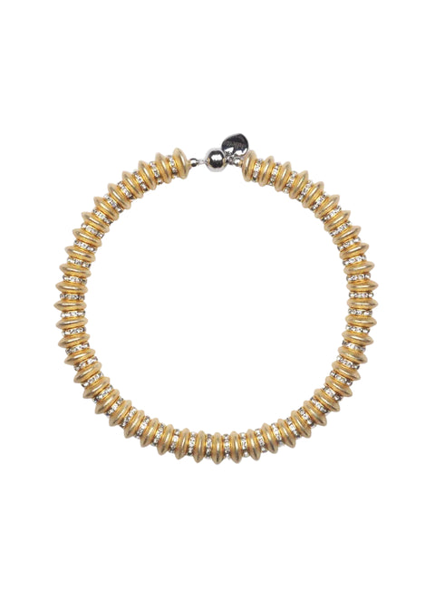 Gold beaded necklace on a white background