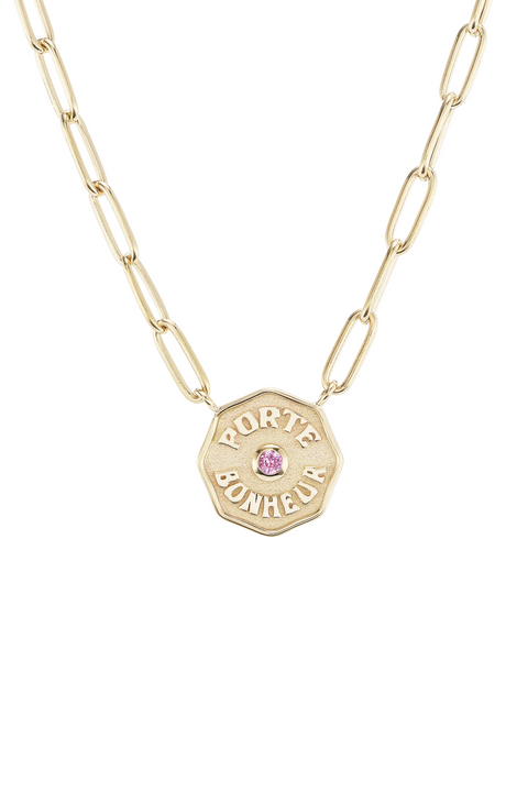 Yellow gold chain necklace with mini 'Porte Bonheur' coin with small pink sapphire in the center.