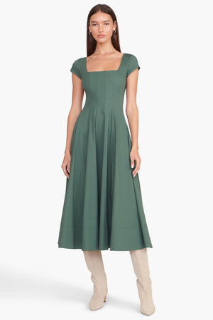 Model facing the camera in the green short sleeve midi dress