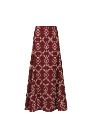 A burgundy patterned maxi skirt on a white background