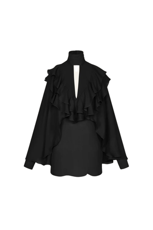 A black long-sleeve blouse with a high mock neck, dramatic cascading ruffles across the shoulders and chest, and a split V-back opening, against a plain white background.