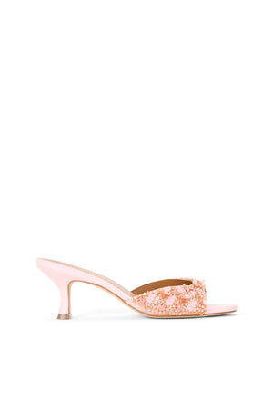 Side profile of a pink embellished kitten heel mule.