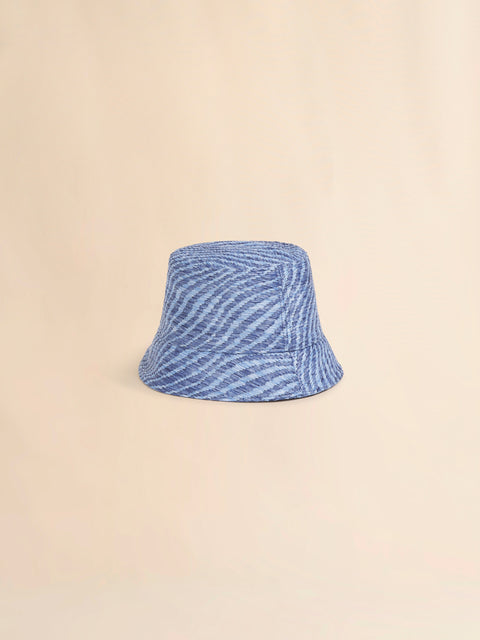 Blue textured bucket hat on a beige background