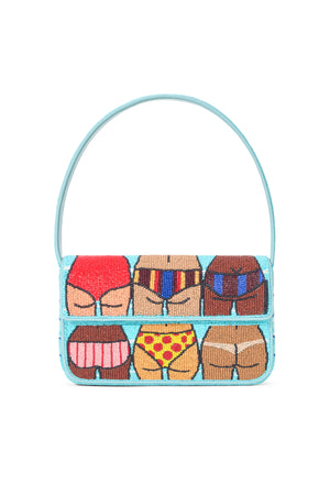 Staud Tommy bag with bikini bottoms design and blue background.