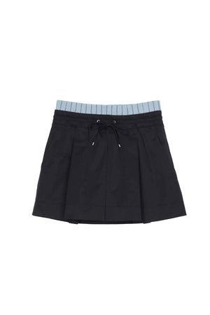 Navy pleated skirt with light blue striped waistband on a white background