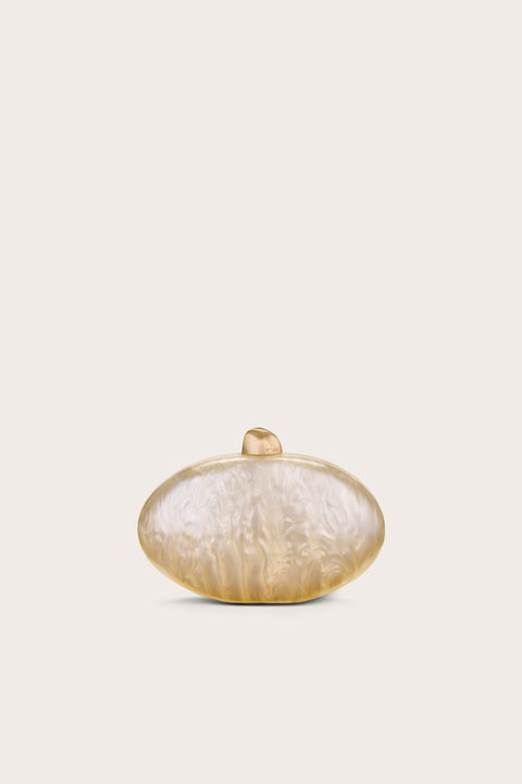 Oval-shaped clutch made out of pearlized acrylic, featuring gold hard wear.