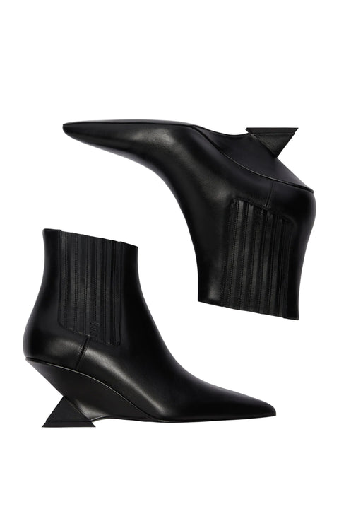 Black wedge ankle boots on a white background