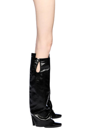 Black knee-high boots with a block heel on a white background