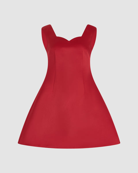 Red mini dress with sweetheart neckline on a light gray background