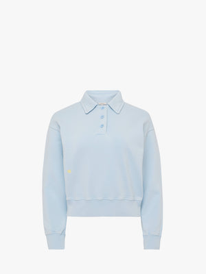 Light blue sweatshirt with a small logo on a white background