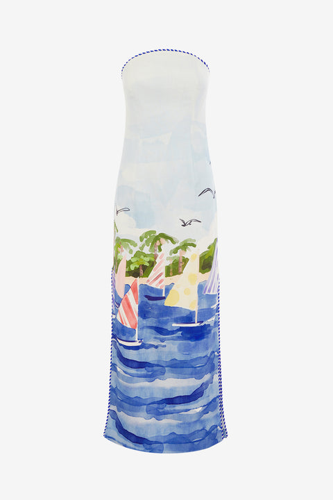 Blue strapless maxi dress with a sailboat scene print on a white background