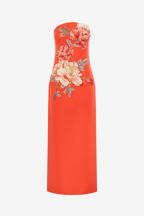 Orange strapless maxi  dress with floral embroidery on a white background