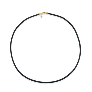 Black necklace with a gold clasp on a white background