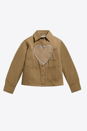 Beige jacket with a heart-shaped cut out element on the front on a white background