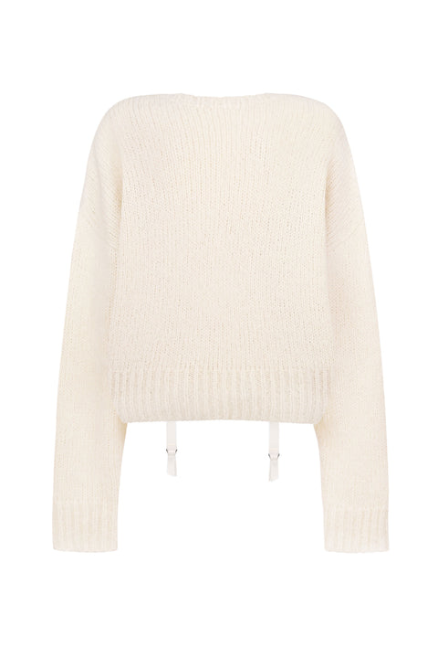 Flat lay of back view of white knit sweater with low hanging ties