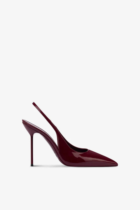 Burgundy patent leather high-heeled slingback shoe on a white background