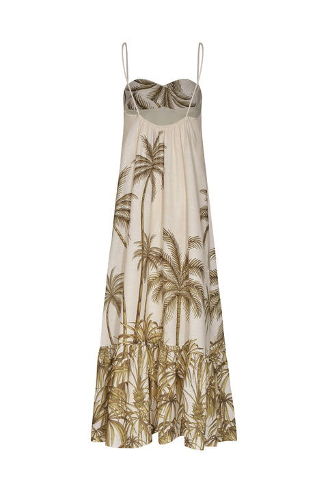 Flat lay of back of white maxi linen dress decorated with palm tree patterning and a tiered skirt