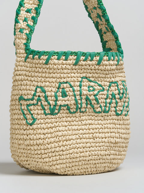 Up close look at Woven bag with green trim and 'Marni' embroidery on a light gray background