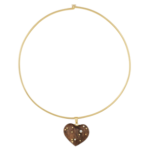 Gold necklace with a walnut heart-shaped pendant on a white background
