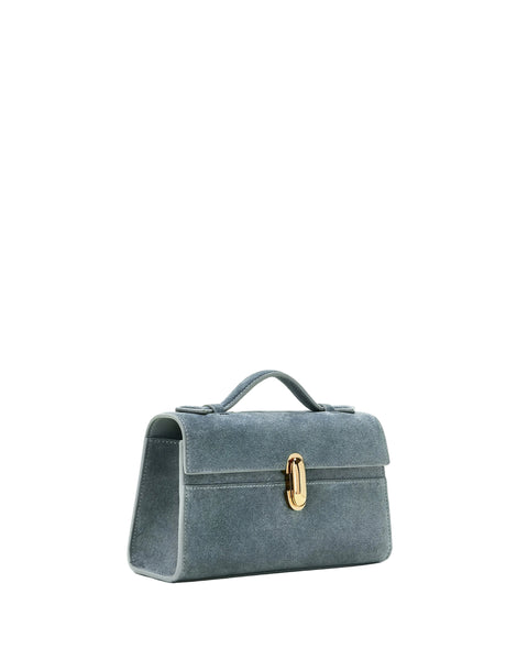 Blue handbag with a gold clasp on a white background