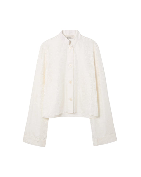 White cropped shirt on a light gray background