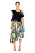 Model wearing the alice pleated asymmetrical midi skirt in floral print
