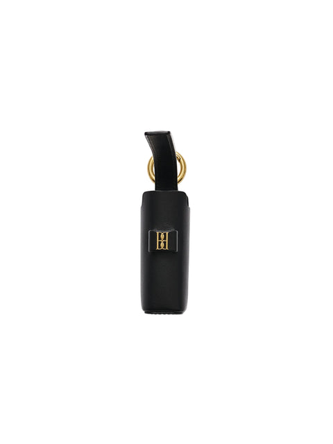 A black leather key pouch with a gold-tone metal ring and a small gold 'HH' logo plaque, shown on a light white background.