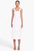 Full body view of a model facing the camera in the white midi dress with lace up bodice