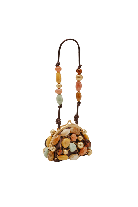 A small handbag with a dark brown leather strap and frame, decorated with numerous smooth, polished stones in earthy tones of brown, beige, orange, and pale green, set against a plain white background.