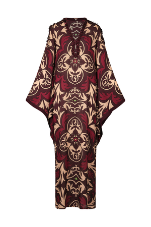 A long, loose kaftan dress featuring an intricate pattern in deep burgundy red and beige, displayed against a solid white background.