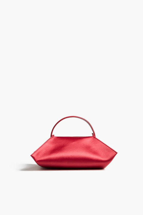 Red handbag on a white background