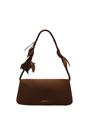 Brown handbag with a floral strap on a white background