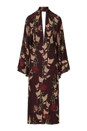A long-sleeved maxi dress with a dark brown base and an all-over floral print featuring beige leaves, red flowers, and green stems, shown against a plain white background.