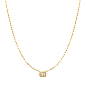 Yellow gold ball chain necklace with oval gypsy solitaire diamond.