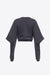 Ghost image of the back side of the cold shoulder sweatshirt in gray.