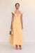 Woman wearing a bright orange maxi dress that features cap sleeves, a sweetheart neckline, and a delicate chest cutout with a twist knot detail. 