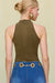 Up close back view of a woman wearing a olive green sleeveless bodysuit that features a mock neck, paired with blue wide leg jeans. 