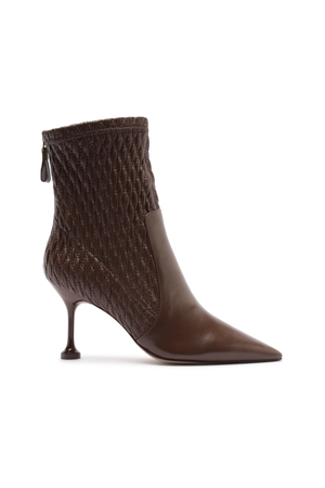 Brown fitted boot with a high heel on a white background