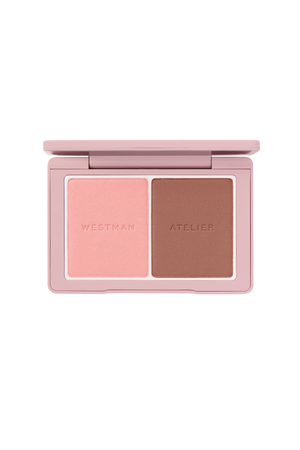 A compact makeup palette with two pans of powder, one light pink and one medium brown, in a dusty pink case. The brand names 'WESTMAN' and 'ATELIER' are embossed on the powders.