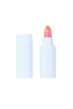 A lipstick and its cap shown side by side on a clean white background. The lipstick bullet is a soft coral pink, and the packaging is a very pale icy blue-white.