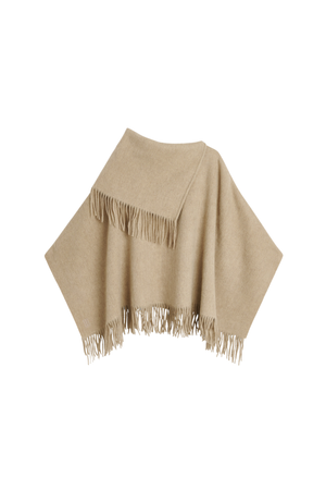 A light beige knit poncho with fringed edges, displayed against a solid white background.