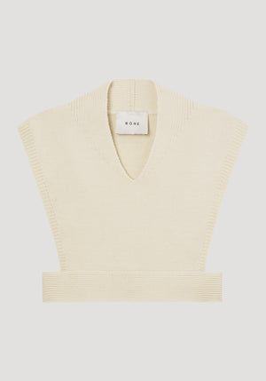 Ghost image of the layering knitted vest in cream.