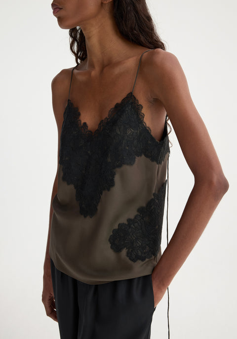 Up close shot of model in green tank with black lace.